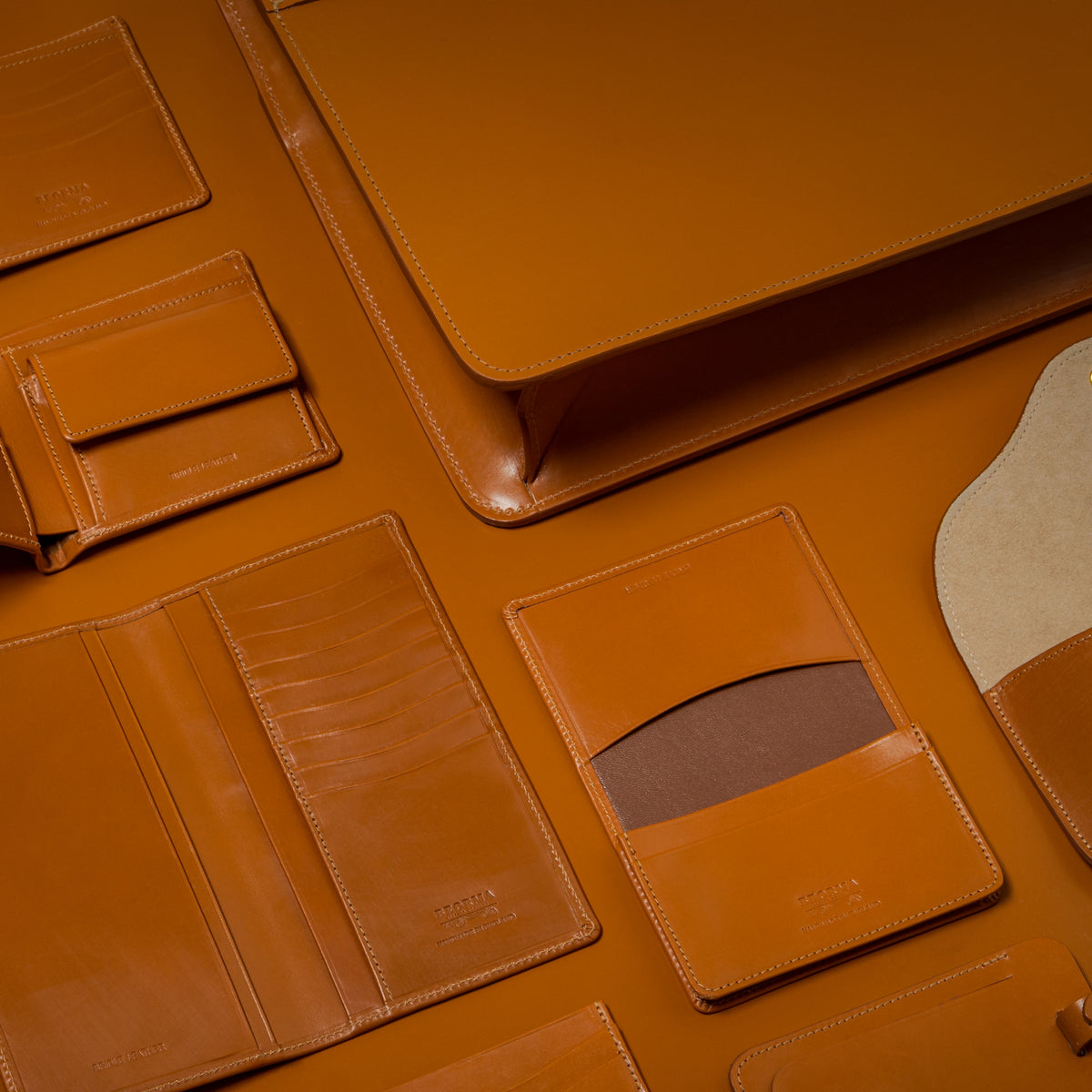 Tan English bridle leather wallets, card cases and briefcase