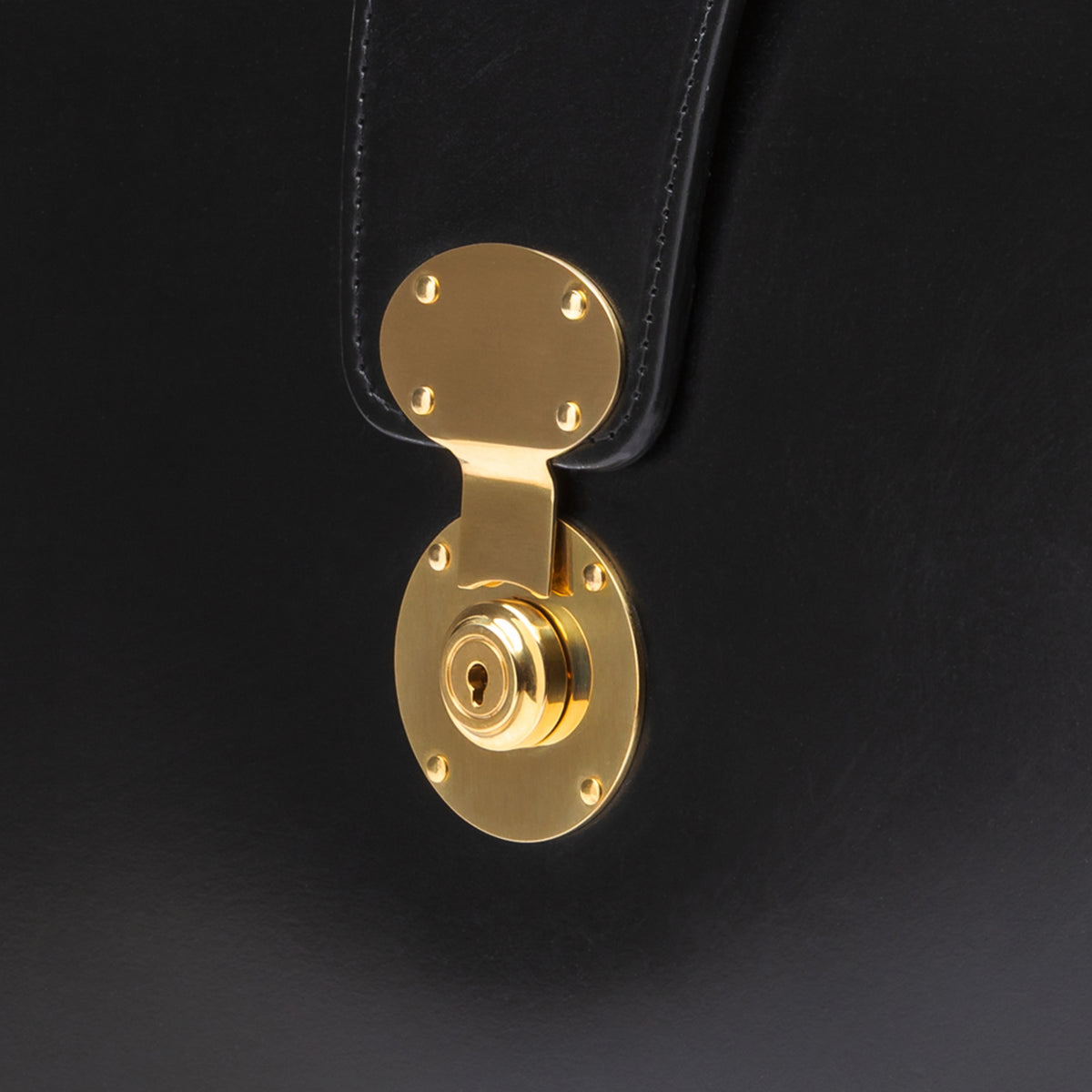 Solid brass lock on a black bridle leather briefcase